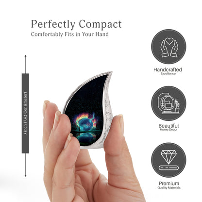 Dark Black Golf Cremation Urn angled view of lid and engraved motif - smooth teardrop contour featuring golf art - mini keepsake memorial for portion of cremation ashes