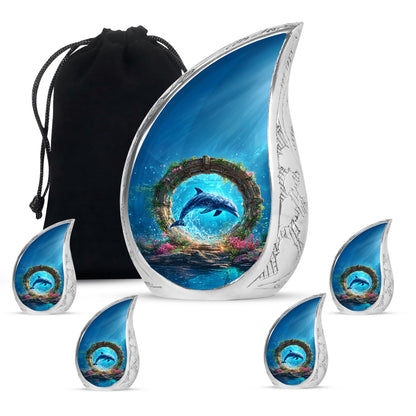 Misty Blue Dolphin Cremation Urn side profile showing urn shape - flowing teardrop dolphin silhouette on curved aluminum - memorial set with one large and four small urns