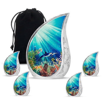 Deep Teal Dolphin Cremation Urn side profile showing urn shape - graceful tear-shaped urn with dolphin motif - memorial set with one large and four small urns