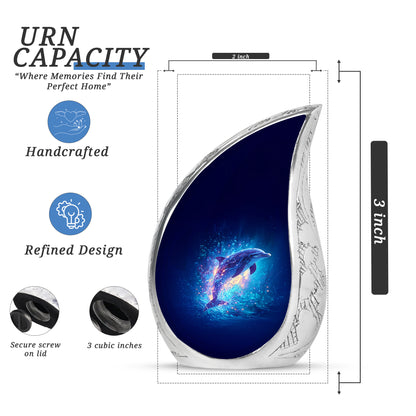 Indigo Dolphin Cremation Urn angled view of lid and engraved motif - flowing teardrop dolphin silhouette on curved aluminum - mini keepsake memorial for portion of cremation ashes