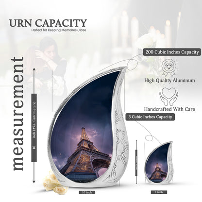 Pastel Blue Eiffel Tower Cremation Urn angled view of lid and engraved motif - rounded teardrop eiffel tower design with delicate detail - mini keepsake memorial for portion of cremation ashes