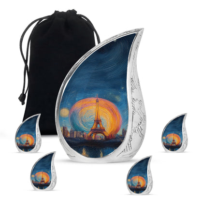 Powder Blue Eiffel Tower Cremation Urn side profile showing urn shape - flowing teardrop eiffel tower silhouette on curved aluminum - memorial set with one large and four small urns