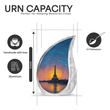 Icy Blue Eiffel Tower Cremation Urn angled view of lid and engraved motif - rounded teardrop eiffel tower design with delicate detail - mini keepsake memorial for portion of cremation ashes