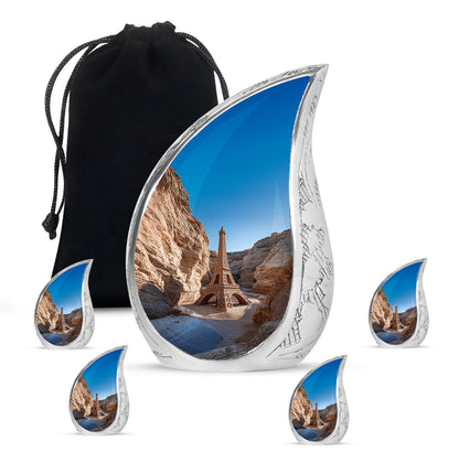 Celestial Blue Eiffel Tower Cremation Urn side profile showing urn shape - rounded teardrop eiffel tower design with delicate detail - memorial set with one large and four small urns