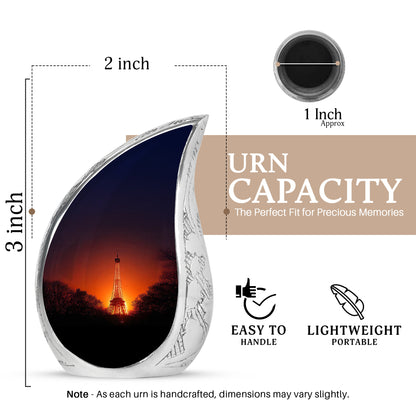 Peony Pink Eiffel Tower Cremation Urn angled view of lid and engraved motif - flowing teardrop eiffel tower silhouette on curved aluminum - mini keepsake memorial for portion of cremation ashes