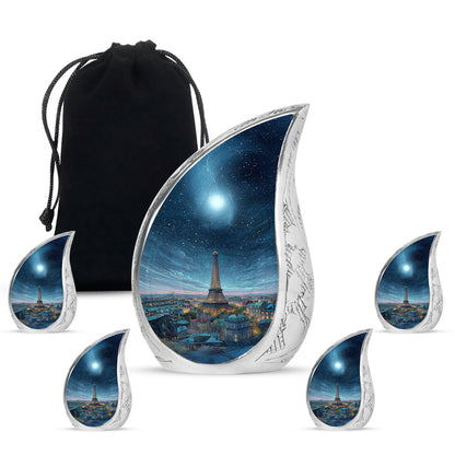Indigo Eiffel Tower Cremation Urn side profile showing urn shape - rounded teardrop eiffel tower design with delicate detail - memorial set with one large and four small urns