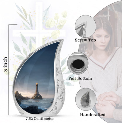 Cobalt Blue Eiffel Tower Cremation Urn angled view of lid and engraved motif - graceful tear-shaped urn with eiffel tower motif - mini keepsake memorial for portion of cremation ashes