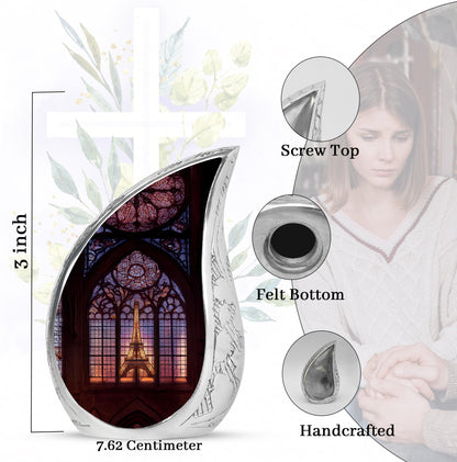 Obsidian Black Eiffel Tower Cremation Urn angled view of lid and engraved motif - smooth teardrop contour featuring eiffel tower art - mini keepsake memorial for portion of cremation ashes