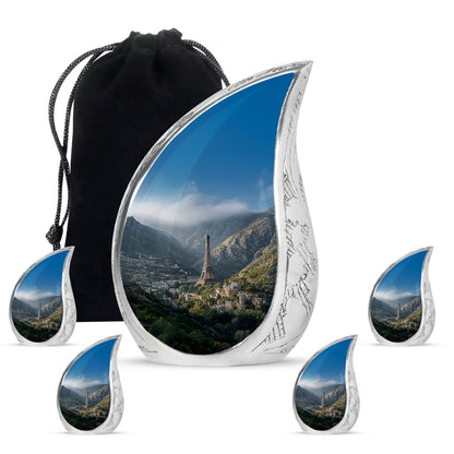Sapphire Blue Eiffel Tower Cremation Urn side profile showing urn shape - smooth teardrop contour featuring eiffel tower art - memorial set with one large and four small urns