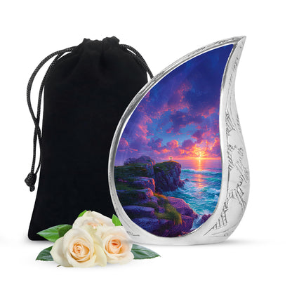 Powder Blue Cross Cremation Urn front view showing detailed design - flowing teardrop cross silhouette on curved aluminum - full-size 10 inch 200 cubic inch adult cremation urn
