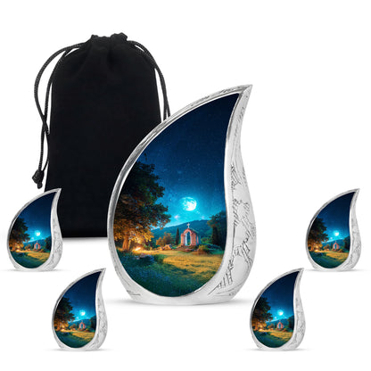Indigo Cross Cremation Urn side profile showing urn shape - rounded teardrop cross design with delicate detail - memorial set with one large and four small urns