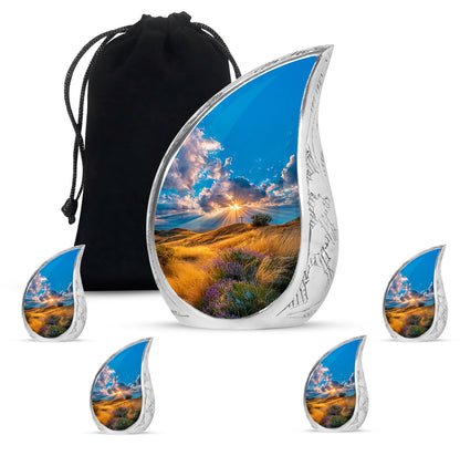 Powder Blue Cross Cremation Urn side profile showing urn shape - flowing teardrop cross silhouette on curved aluminum - memorial set with one large and four small urns