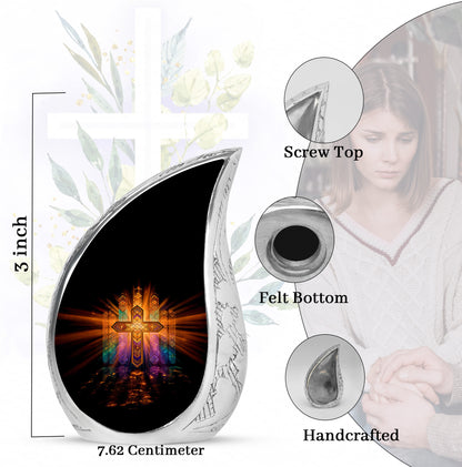 Obsidian Black Cross Cremation Urn angled view of lid and engraved motif - graceful tear-shaped urn with cross motif - mini keepsake memorial for portion of cremation ashes