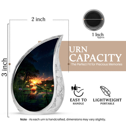 Cobalt Blue Frog Cremation Urn angled view of lid and engraved motif - smooth teardrop contour featuring frog art - mini keepsake memorial for portion of cremation ashes