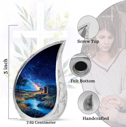 Powder Blue Frog Cremation Urn angled view of lid and engraved motif - flowing teardrop frog silhouette on curved aluminum - mini keepsake memorial for portion of cremation ashes