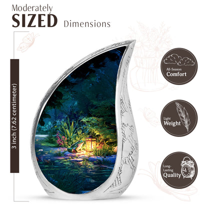 Navy Blue Frog Cremation Urn angled view of lid and engraved motif - rounded teardrop frog design with delicate detail - mini keepsake memorial for portion of cremation ashes