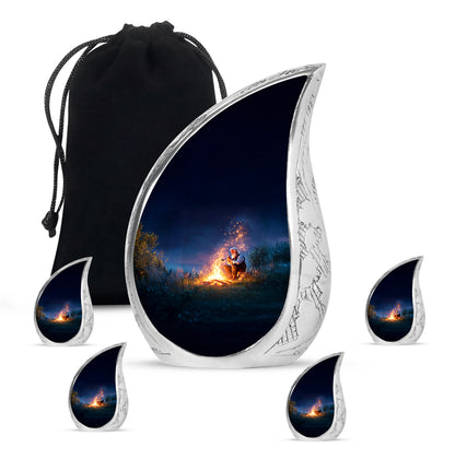 Dusty Blue Campfire Cremation Urn side profile showing urn shape - flowing teardrop campfire silhouette on curved aluminum - memorial set with one large and four small urns