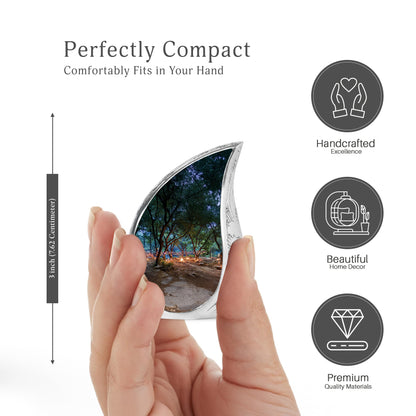 Midnight Black Campfire Cremation Urn angled view of lid and engraved motif - graceful tear-shaped urn with campfire motif - mini keepsake memorial for portion of cremation ashes
