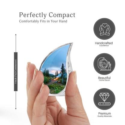 Calming Blue Campfire Cremation Urn angled view of lid and engraved motif - graceful tear-shaped urn with campfire motif - mini keepsake memorial for portion of cremation ashes