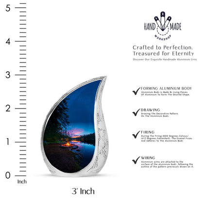 Serene Blue Campfire Cremation Urn angled view of lid and engraved motif - graceful tear-shaped urn with campfire motif - mini keepsake memorial for portion of cremation ashes