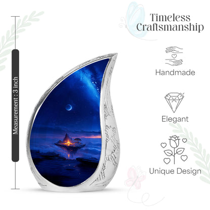 Sapphire Blue Campfire Cremation Urn angled view of lid and engraved motif - smooth teardrop contour featuring campfire art - mini keepsake memorial for portion of cremation ashes