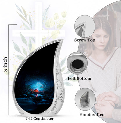 Glossy Black Halloween Cremation Urn angled view of lid and engraved motif - rounded teardrop halloween design with delicate detail - mini keepsake memorial for portion of cremation ashes