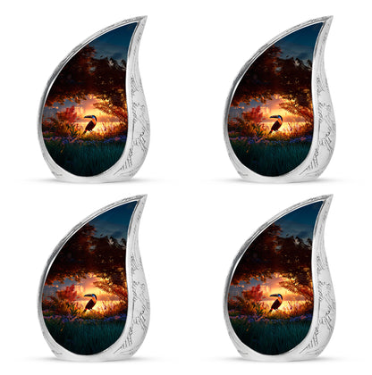 Crimson Red Hornbill Cremation Urn close-up of engraving and surface detail - rounded teardrop hornbill design with delicate detail - 10 inch aluminum urn for cremated remains