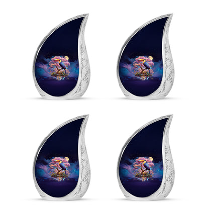 Sapphire Blue Hornbill Cremation Urn close-up of engraving and surface detail - smooth teardrop contour featuring hornbill art - 10 inch aluminum urn for cremated remains