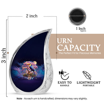 Vivid Blue Hornbill Cremation Urn angled view of lid and engraved motif - smooth teardrop contour featuring hornbill art - mini keepsake memorial for portion of cremation ashes
