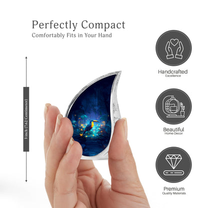Sapphire Blue Hornbill Cremation Urn angled view of lid and engraved motif - graceful tear-shaped urn with hornbill motif - mini keepsake memorial for portion of cremation ashes