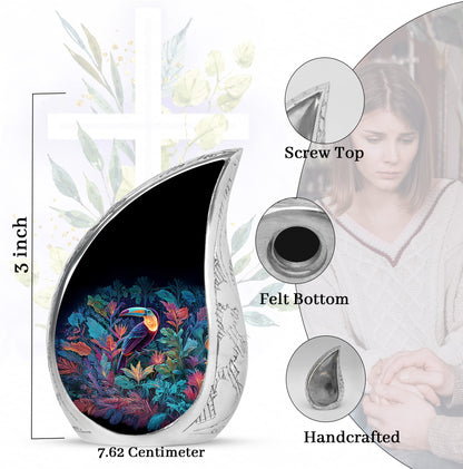 Icy Blue Hornbill Cremation Urn angled view of lid and engraved motif - flowing teardrop hornbill silhouette on curved aluminum - mini keepsake memorial for portion of cremation ashes