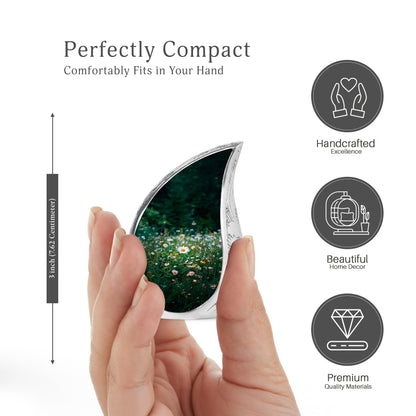 Sage Green Daisy Cremation Urn angled view of lid and engraved motif - rounded teardrop daisy design with delicate detail - mini keepsake memorial for portion of cremation ashes