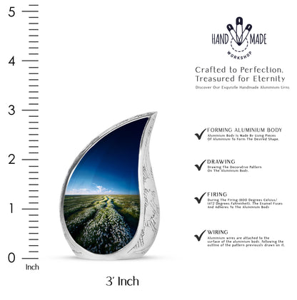 Slate Blue Daisy Cremation Urn angled view of lid and engraved motif - flowing teardrop daisy silhouette on curved aluminum - mini keepsake memorial for portion of cremation ashes