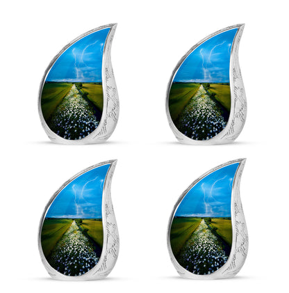 Indigo Daisy Cremation Urn close-up of engraving and surface detail - flowing teardrop daisy silhouette on curved aluminum - 10 inch aluminum urn for cremated remains