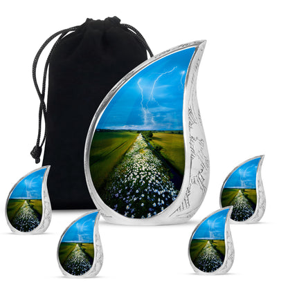 Sky Blue Daisy Cremation Urn side profile showing urn shape - rounded teardrop daisy design with delicate detail - memorial set with one large and four small urns