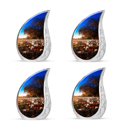 Amber Gold Daisy Cremation Urn close-up of engraving and surface detail - flowing teardrop daisy silhouette on curved aluminum - 10 inch aluminum urn for cremated remains