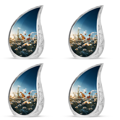 Vivid Blue Daisy Cremation Urn close-up of engraving and surface detail - graceful tear-shaped urn with daisy motif - 10 inch aluminum urn for cremated remains