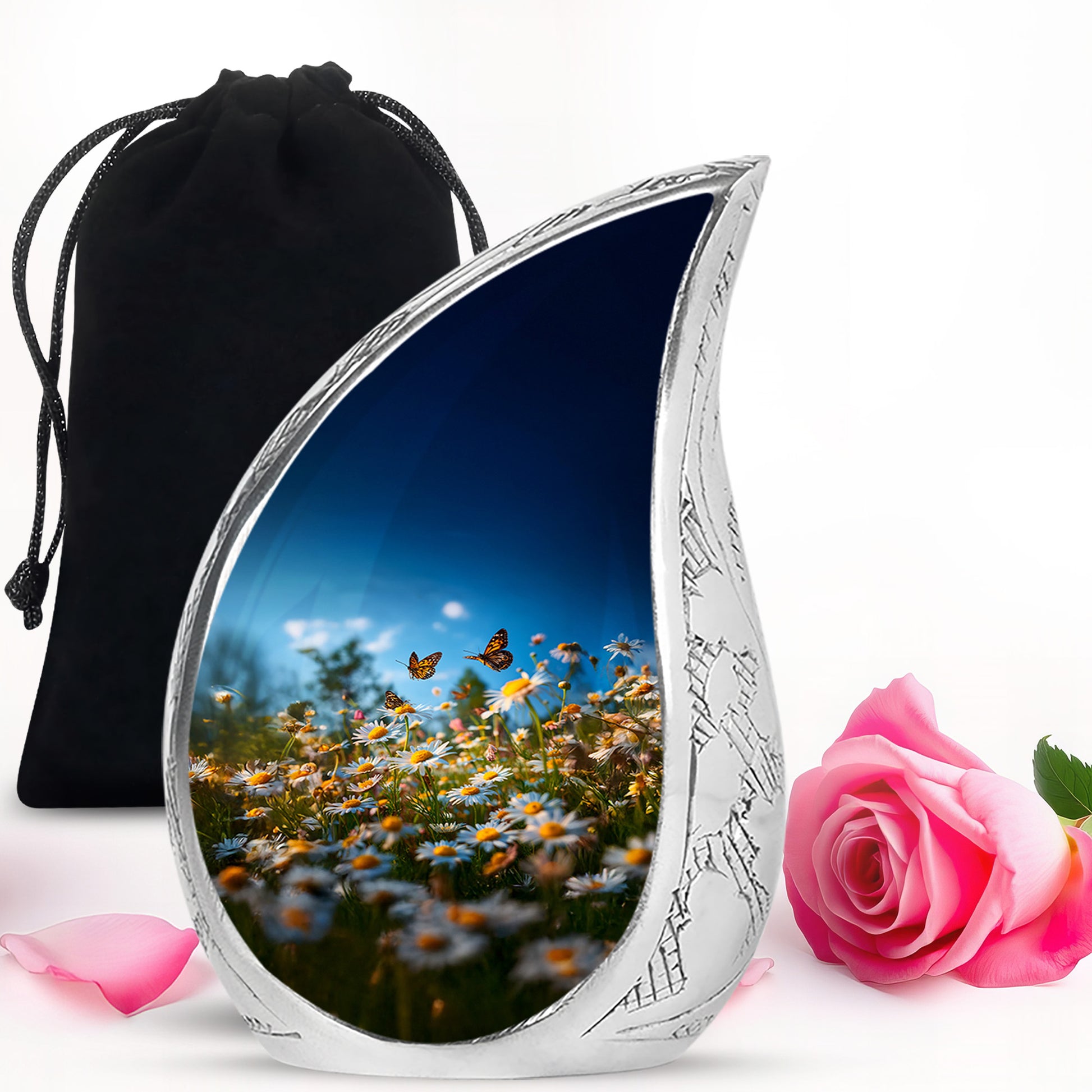 Indigo Daisy Cremation Urn front view showing detailed design - flowing teardrop daisy silhouette on curved aluminum - full-size 10 inch 200 cubic inch adult cremation urn