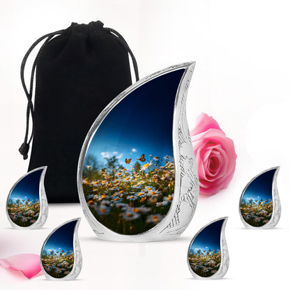 Royal Blue Daisy Cremation Urn side profile showing urn shape - smooth teardrop contour featuring daisy art - memorial set with one large and four small urns