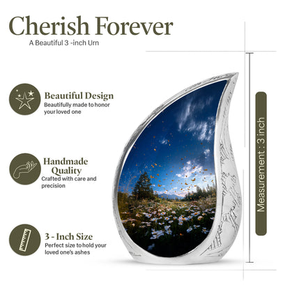 Royal Blue Daisy Cremation Urn angled view of lid and engraved motif - graceful tear-shaped urn with daisy motif - mini keepsake memorial for portion of cremation ashes