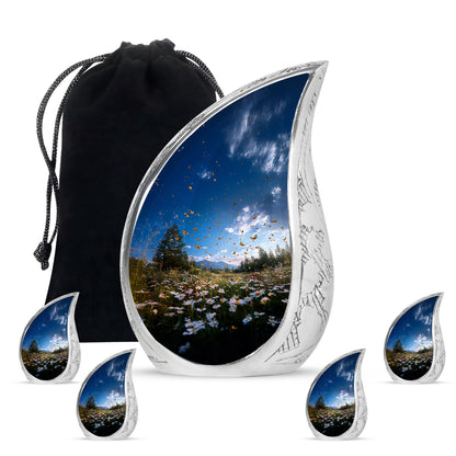 Bright Blue Daisy Cremation Urn side profile showing urn shape - smooth teardrop contour featuring daisy art - memorial set with one large and four small urns
