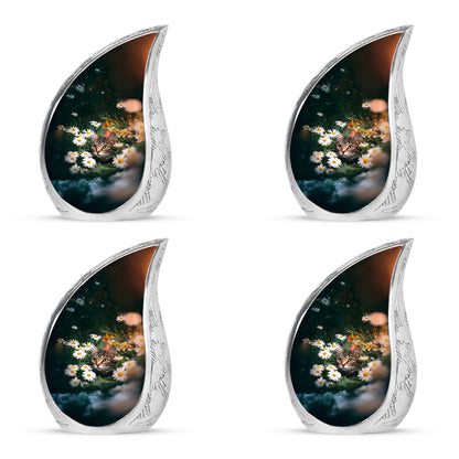 Jade Green Daisy Cremation Urn close-up of engraving and surface detail - flowing teardrop daisy silhouette on curved aluminum - 10 inch aluminum urn for cremated remains