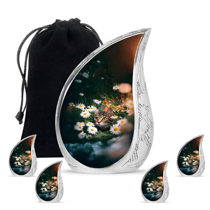 Jade Green Daisy Cremation Urn side profile showing urn shape - flowing teardrop daisy silhouette on curved aluminum - memorial set with one large and four small urns