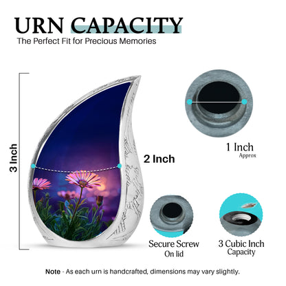Icy Blue Daisy Cremation Urn angled view of lid and engraved motif - flowing teardrop daisy silhouette on curved aluminum - mini keepsake memorial for portion of cremation ashes