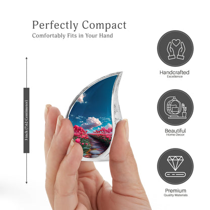 Misty Blue Garden Tulip Cremation Urn angled view of lid and engraved motif - rounded teardrop garden tulip design with delicate detail - mini keepsake memorial for portion of cremation ashes
