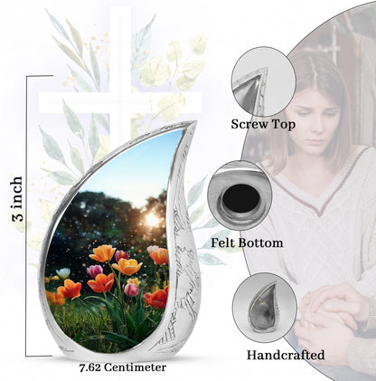 Obsidian Black Garden Tulip Cremation Urn angled view of lid and engraved motif - smooth teardrop contour featuring garden tulip art - mini keepsake memorial for portion of cremation ashes