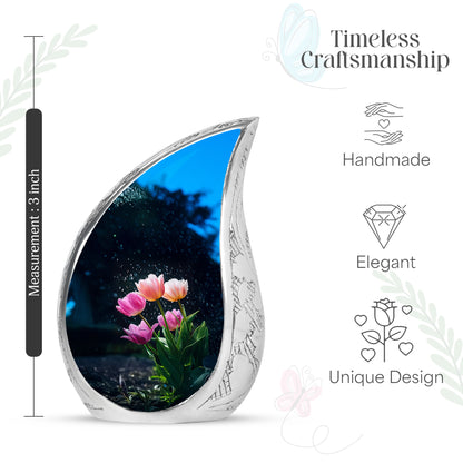 Cornflower Blue Garden Tulip Cremation Urn angled view of lid and engraved motif - graceful tear-shaped urn with garden tulip motif - mini keepsake memorial for portion of cremation ashes