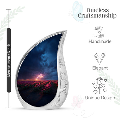 Serene Blue Garden Tulip Cremation Urn angled view of lid and engraved motif - graceful tear-shaped urn with garden tulip motif - mini keepsake memorial for portion of cremation ashes
