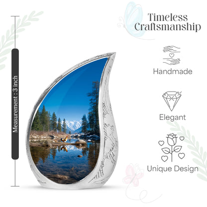 Sky Blue Hen Cremation Urn angled view of lid and engraved motif - rounded teardrop hen design with delicate detail - mini keepsake memorial for portion of cremation ashes