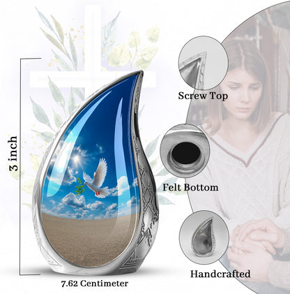 Navy Blue Dove Cremation Urn angled view of lid and engraved motif - rounded teardrop dove design with delicate detail - mini keepsake memorial for portion of cremation ashes